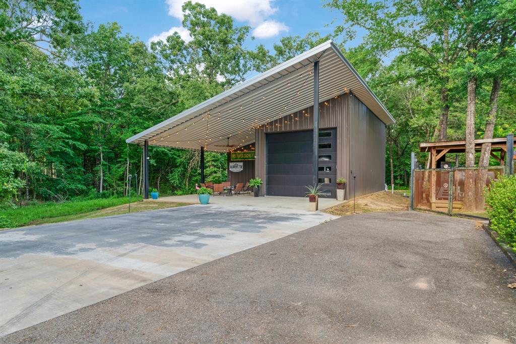 323 County Road Powderly, TX 75473 - Photo 27 of 36 a view of backyard of house and trees