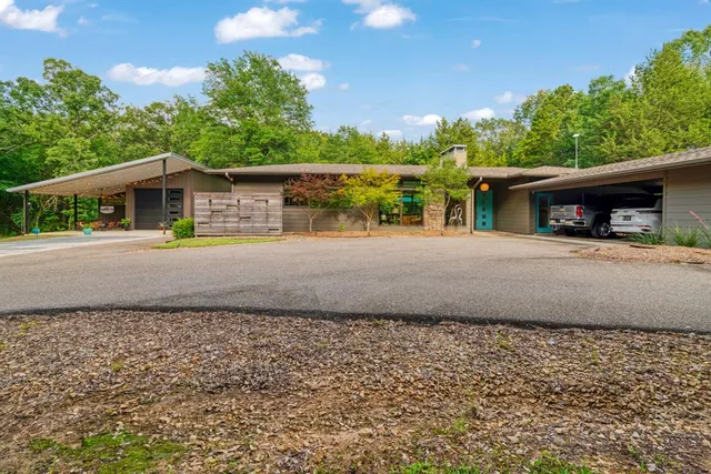 a front view of a house with a yard and a garage