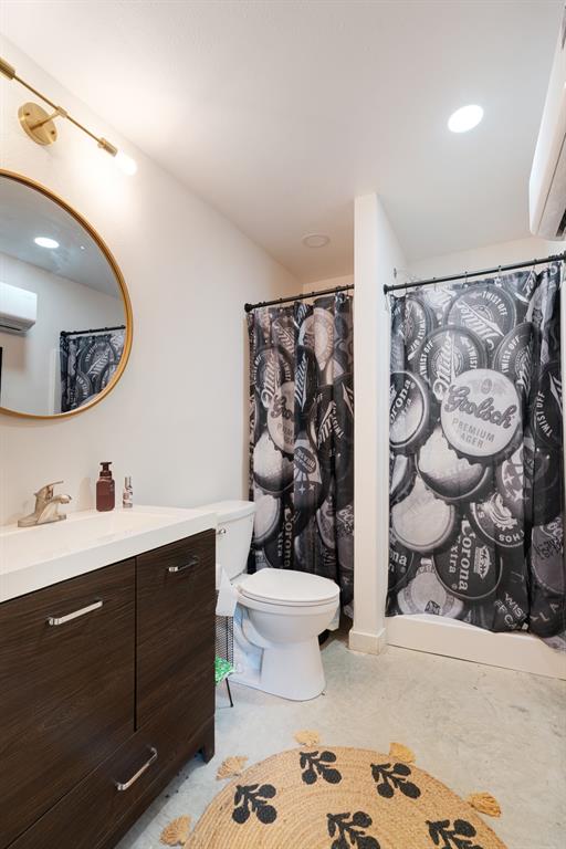 323 County Road Powderly, TX 75473 - Photo 32 of 36 a bathroom with a sink a toilet and mirror
