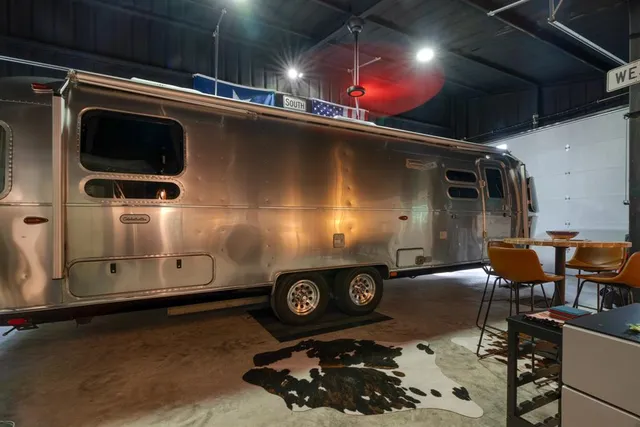 a room with furniture and a projector screen