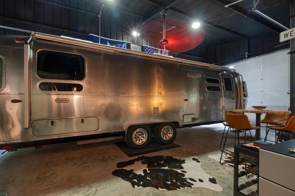 323 County Road Powderly, TX 75473 - Photo 33 of 36 a room with furniture and a projector screen