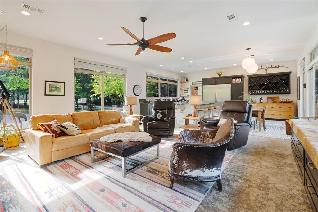 323 County Road Powderly, TX 75473 - Photo 5 of 36 a living room with fireplace furniture and a large window