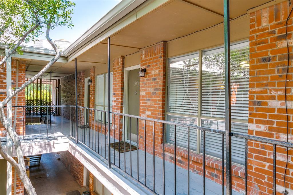 4525 Gilbert Avenue, Unit 203 Dallas, TX 75219 - Photo 2 of 6 a view of balcony with glass door and outdoor space