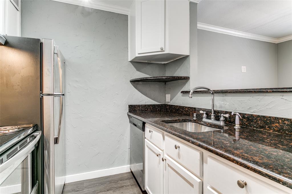 4525 Gilbert Avenue, Unit 203 Dallas, TX 75219 - Photo 4 of 6 a kitchen with a sink a stove and a refrigerator