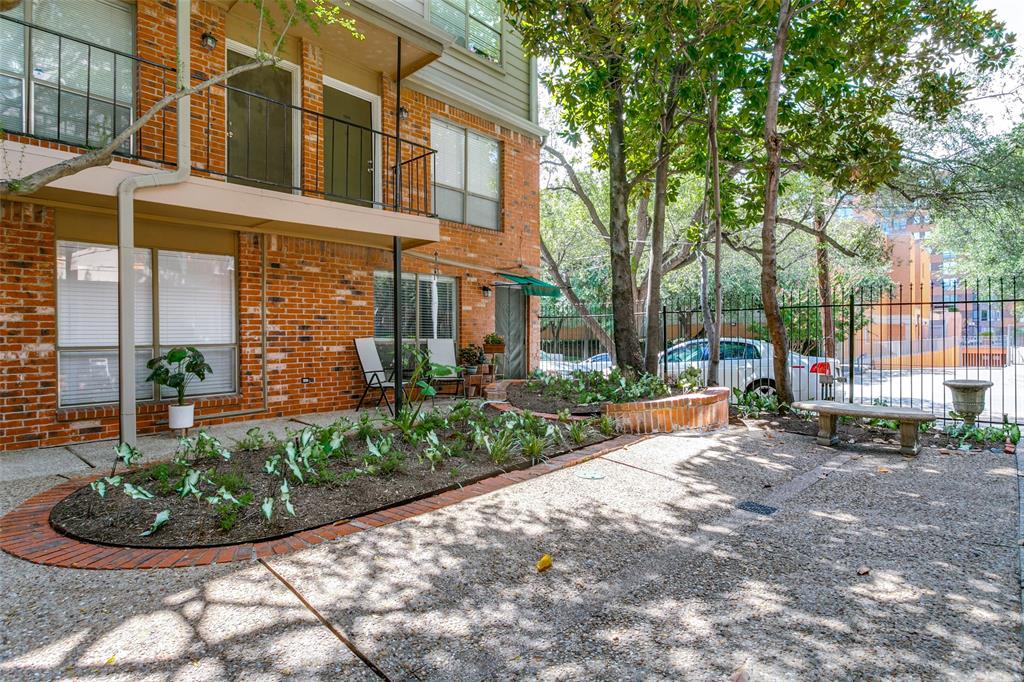 4525 Gilbert Avenue, Unit 203 Dallas, TX 75219 - Photo 6 of 6 a view of a building with a garden