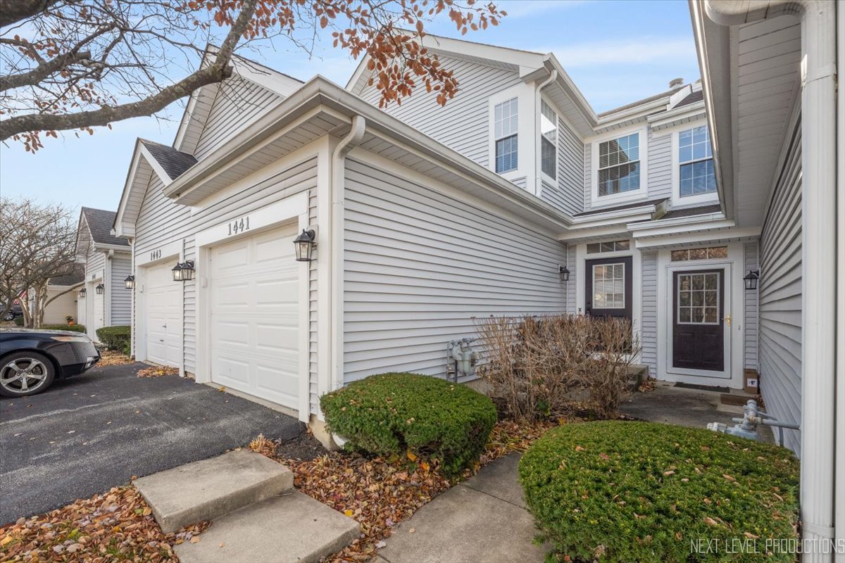1441 Walnut Hill Avenue St. Charles, IL 60174 - Photo 1 of 22 a view of a house with a yard