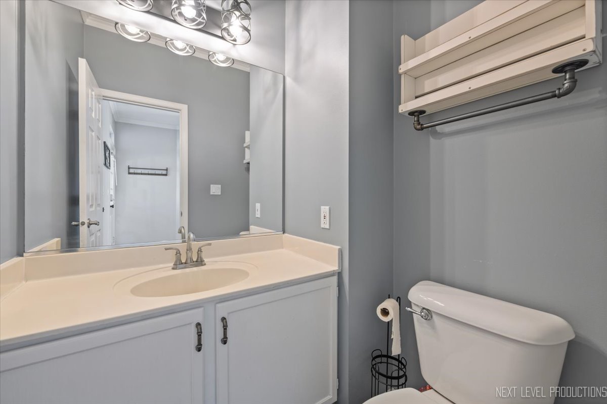 1441 Walnut Hill Avenue St. Charles, IL 60174 - Photo 12 of 22 a bathroom with a sink toilet and vanity