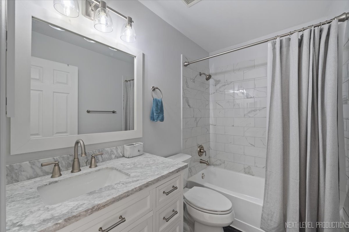 1441 Walnut Hill Avenue St. Charles, IL 60174 - Photo 16 of 22 a bathroom with a granite countertop sink toilet and shower
