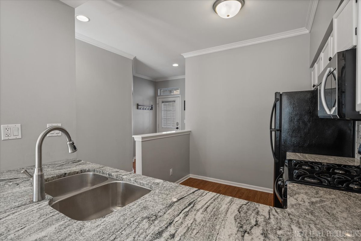 1441 Walnut Hill Avenue St. Charles, IL 60174 - Photo 6 of 22 a kitchen with a refrigerator sink and cabinets