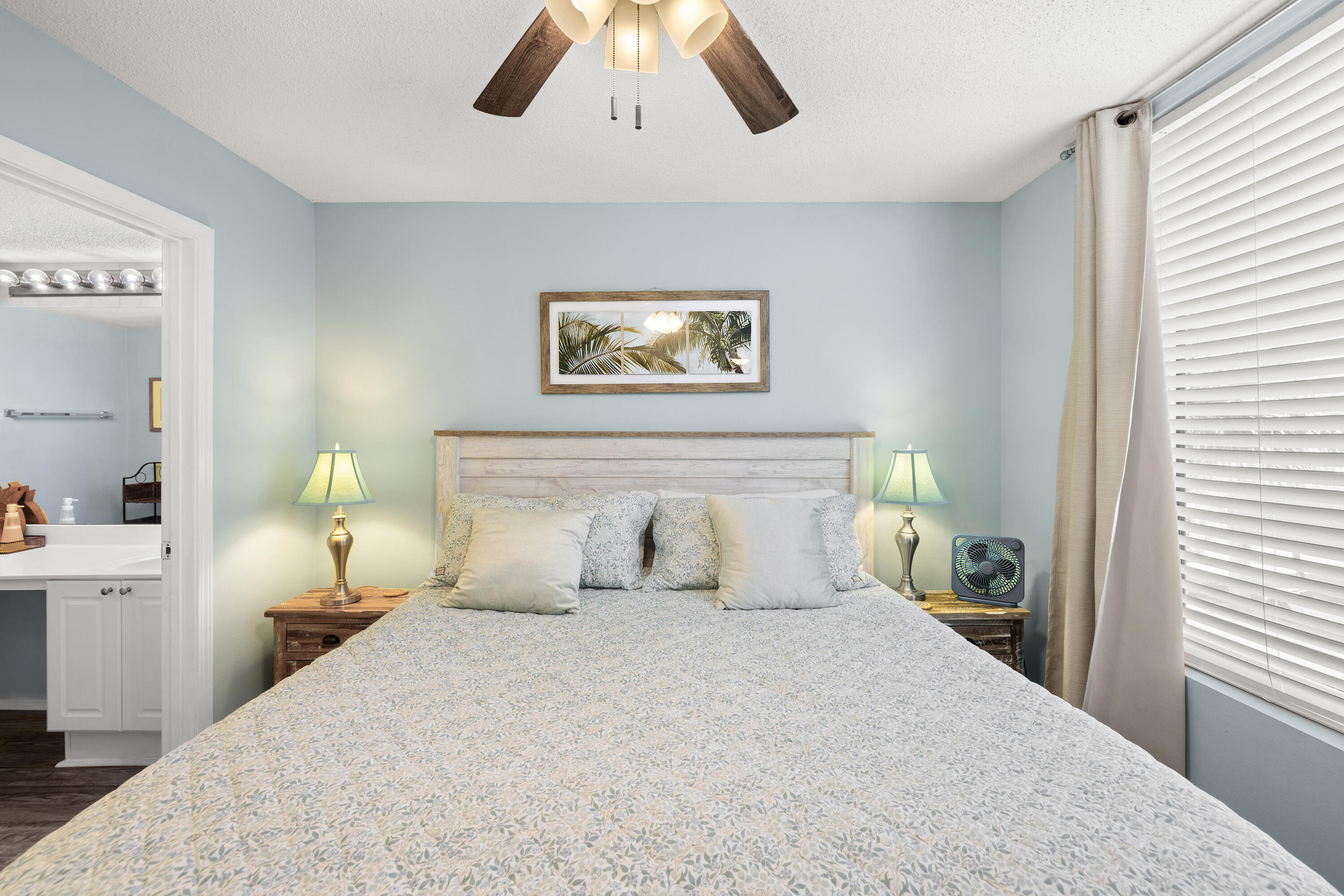 520 Santa Rosa Boulevard, Unit 319 Fort Walton Beach, FL 32548 - Photo 23 of 43 a bedroom with a large bed and a chandelier