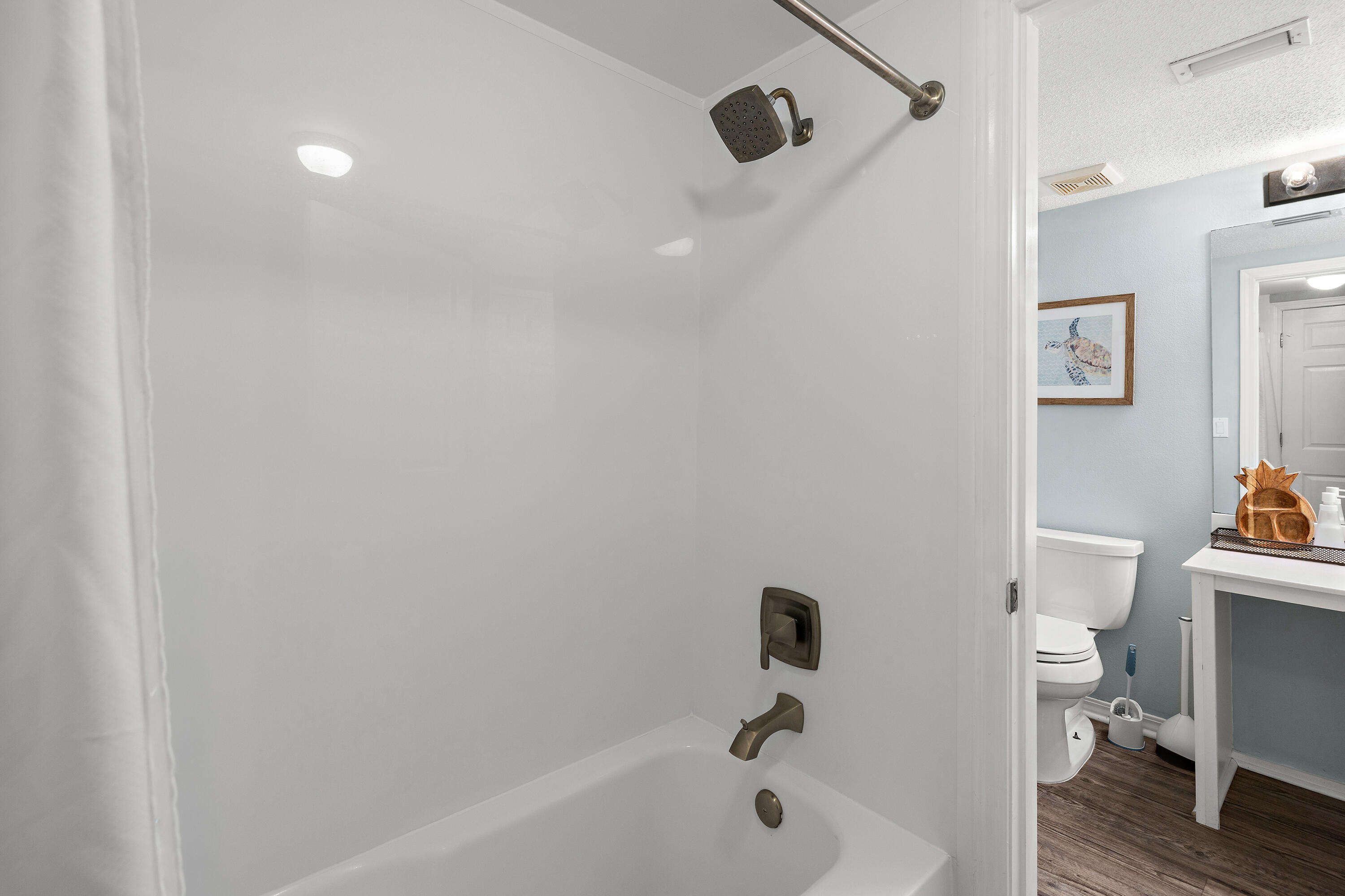 520 Santa Rosa Boulevard, Unit 319 Fort Walton Beach, FL 32548 - Photo 30 of 43 a bathroom with a bathtub shower sink vanity and toilet