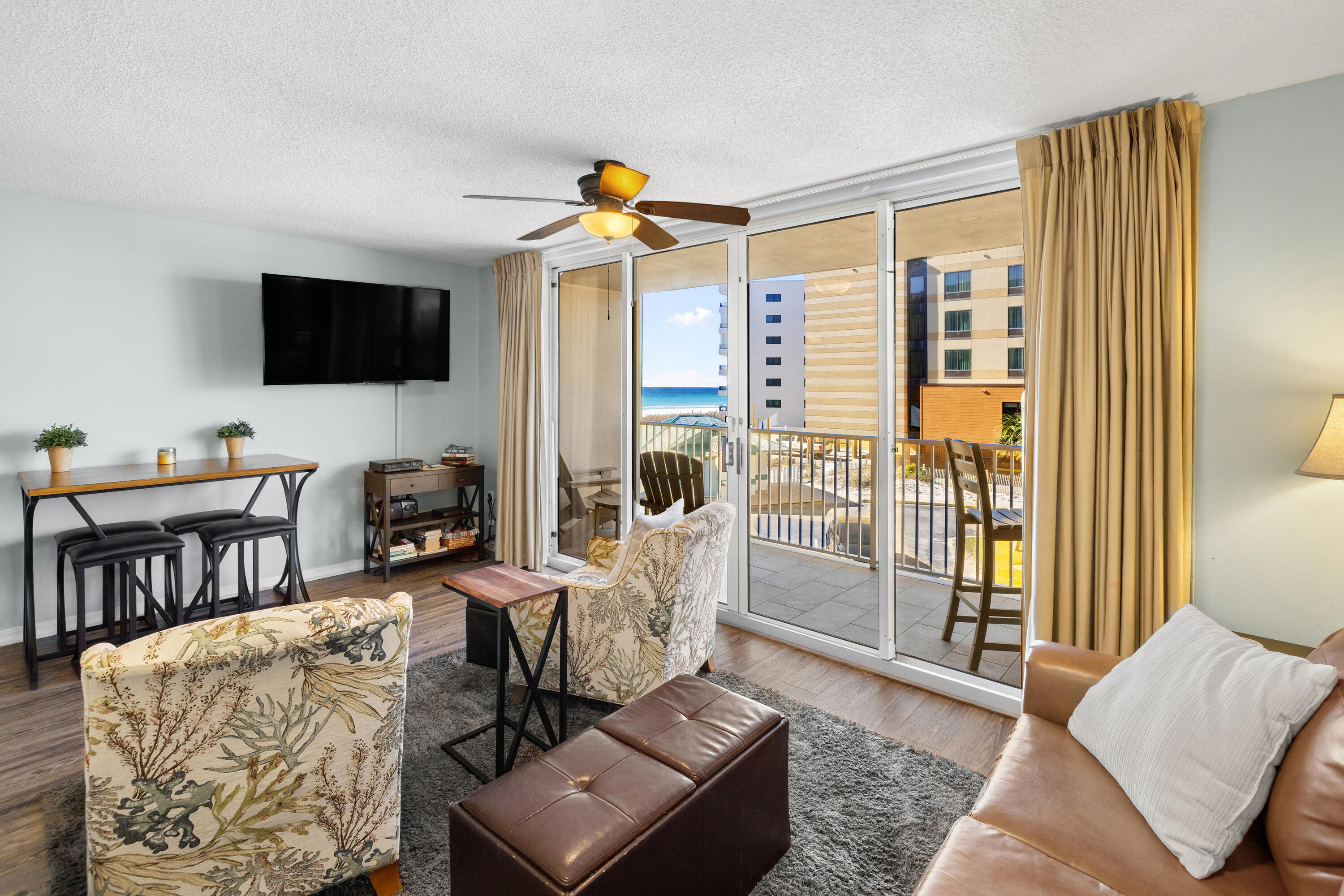 520 Santa Rosa Boulevard, Unit 319 Fort Walton Beach, FL 32548 - Photo 5 of 43 a living room with furniture and a flat screen tv