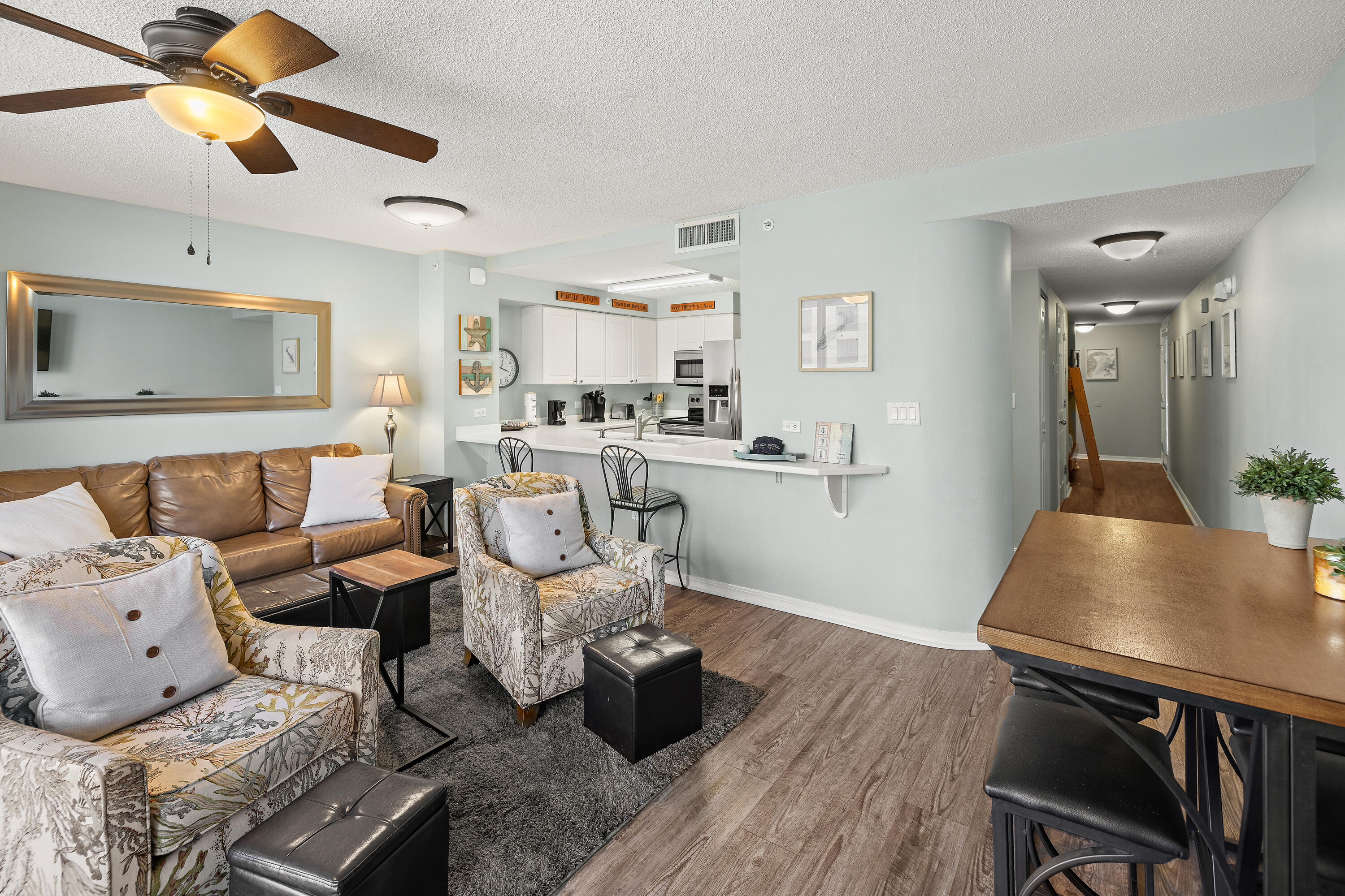 520 Santa Rosa Boulevard, Unit 319 Fort Walton Beach, FL 32548 - Photo 8 of 43 a living room with furniture and wooden floor