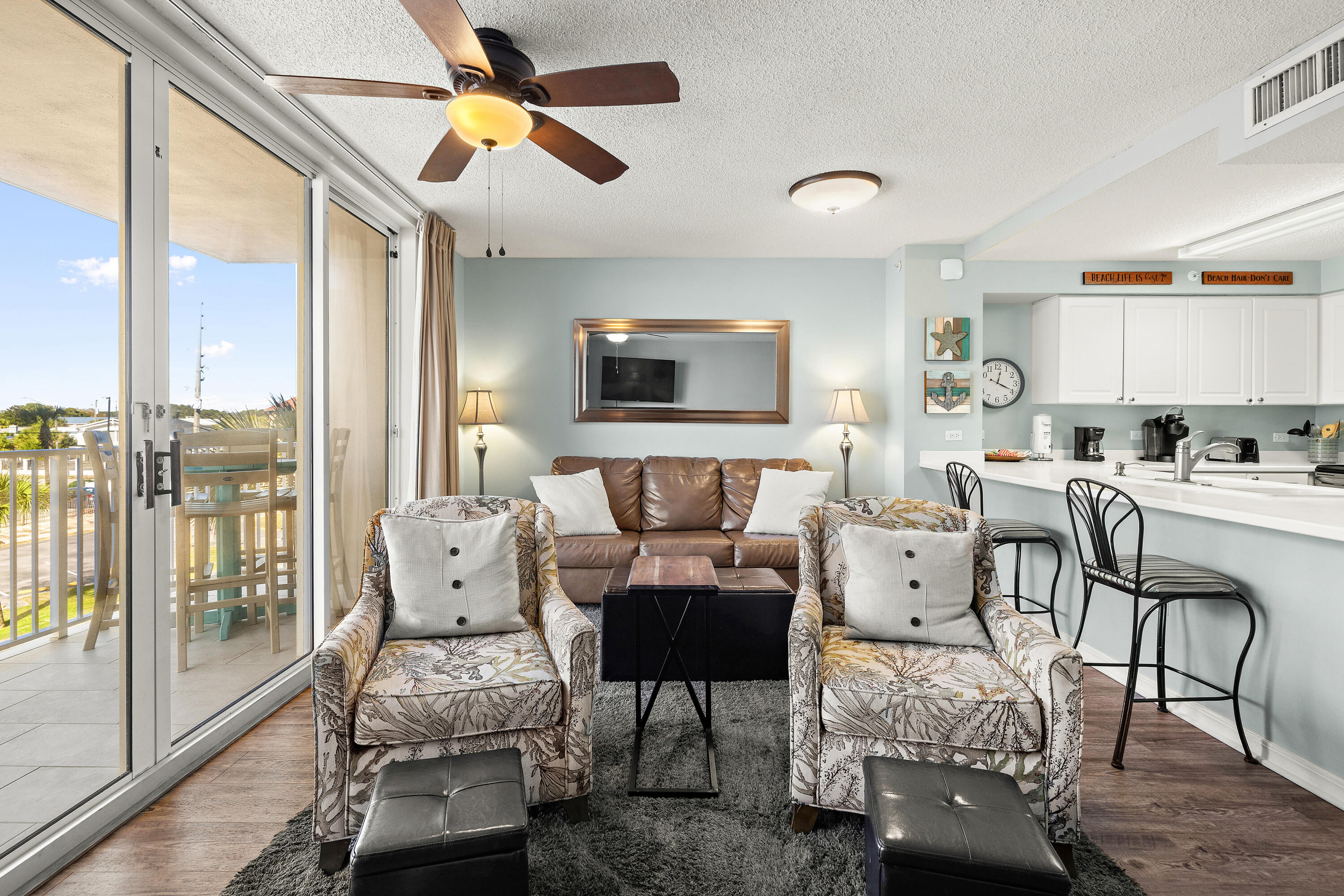 520 Santa Rosa Boulevard, Unit 319 Fort Walton Beach, FL 32548 - Photo 9 of 43 a living room with furniture and a floor to ceiling window
