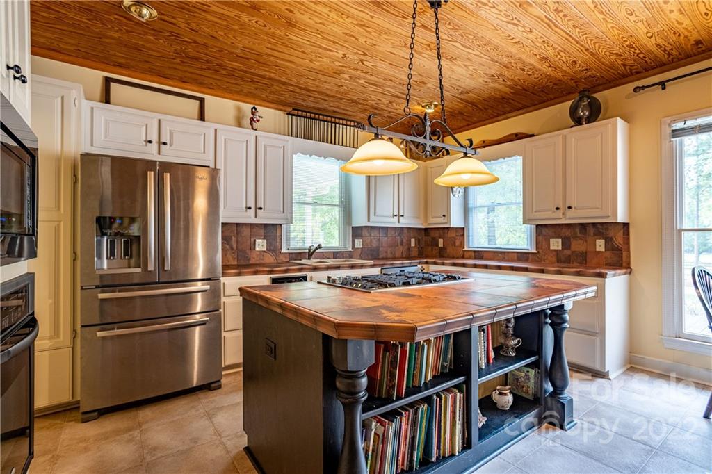 200 Hunt Trace, Unit B Camden, SC 29020 - Photo 11 of 40 a kitchen with stainless steel appliances granite countertop a stove a refrigerator and a refrigerator