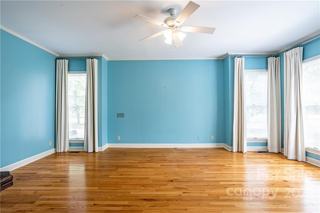 200 Hunt Trace, Unit B Camden, SC 29020 - Photo 12 of 40 an empty room with window and ceiling fan