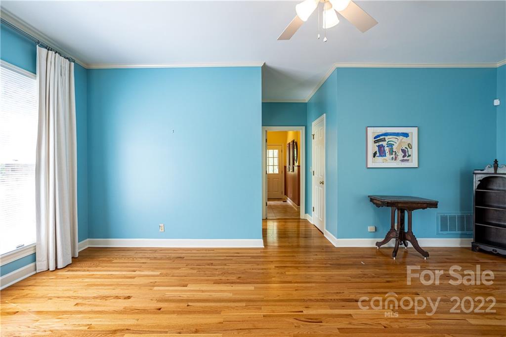 200 Hunt Trace, Unit B Camden, SC 29020 - Photo 13 of 40 a view of an empty room with window and wooden floor