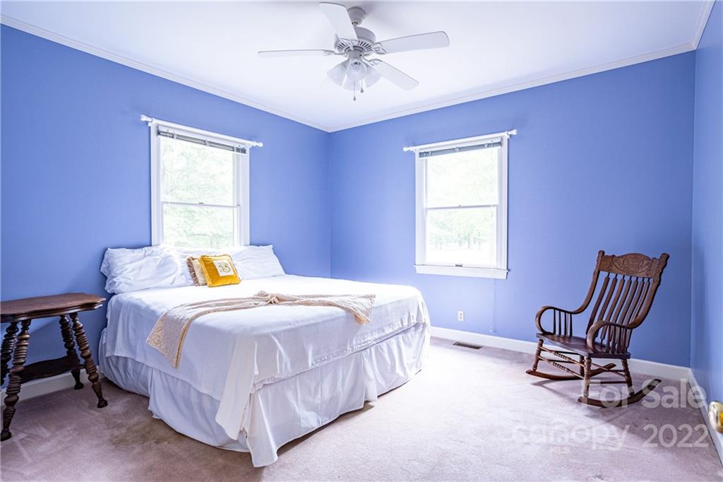 200 Hunt Trace, Unit B Camden, SC 29020 - Photo 18 of 40 a bedroom with a bed chair and window