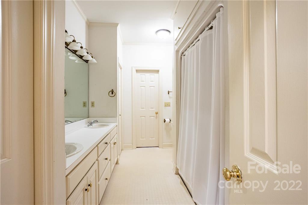 200 Hunt Trace, Unit B Camden, SC 29020 - Photo 21 of 40 a bathroom with a double vanity sink and mirror