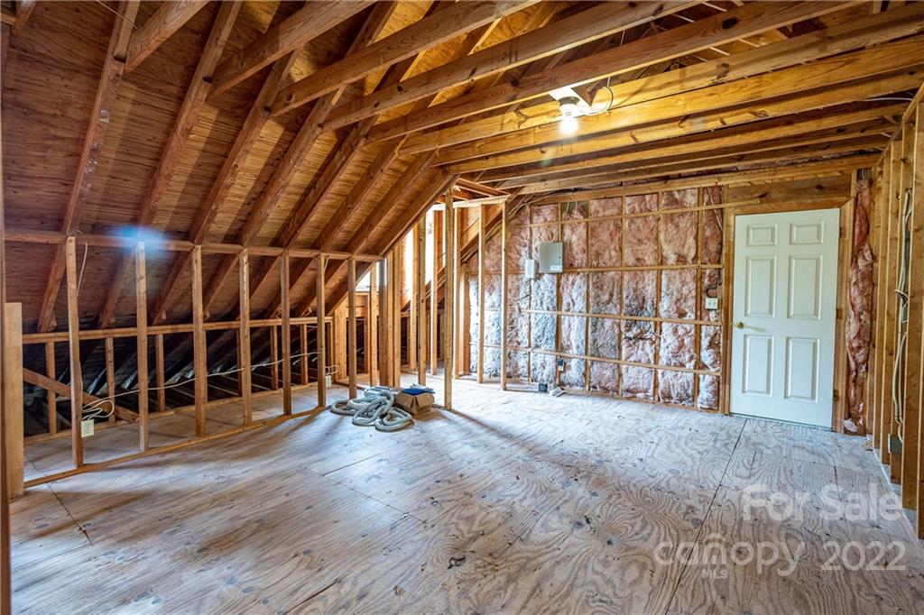 200 Hunt Trace, Unit B Camden, SC 29020 - Photo 26 of 40 a view of an empty room with wooden floor and a window