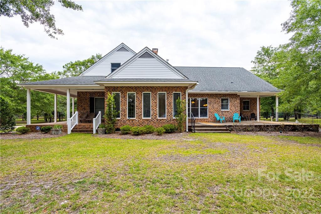 200 Hunt Trace, Unit B Camden, SC 29020 - Photo 28 of 40 a view of a house with a swimming pool and a yard
