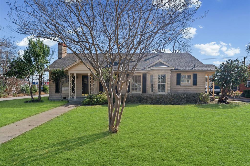1919 North 7th Street Temple, TX 76501 - Photo 1 of 36 a front view of a house with a garden and trees