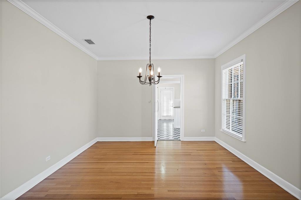 1919 North 7th Street Temple, TX 76501 - Photo 12 of 36 a view of a room with wooden floor ceiling fan and windows