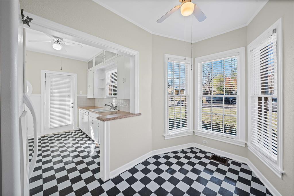 1919 North 7th Street Temple, TX 76501 - Photo 17 of 36 a kitchen with a checkered floor and window