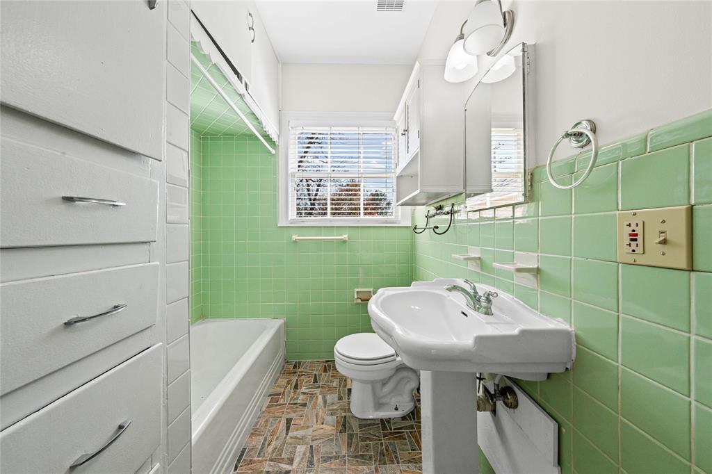 1919 North 7th Street Temple, TX 76501 - Photo 29 of 36 a bathroom with a sink toilet and shower