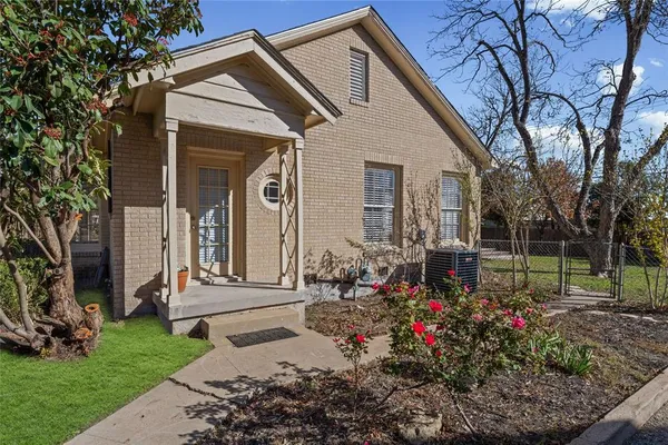 a view of a house with a backyard and garden