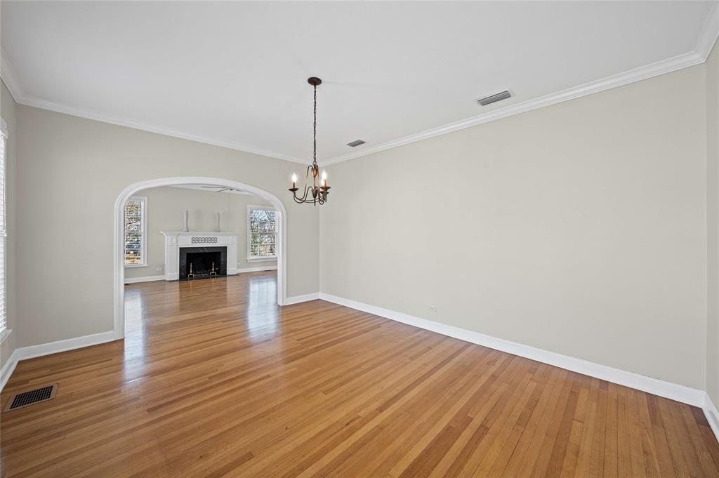 1919 North 7th Street Temple, TX 76501 - Photo 10 of 36 a view of empty room with wooden floor and fireplace