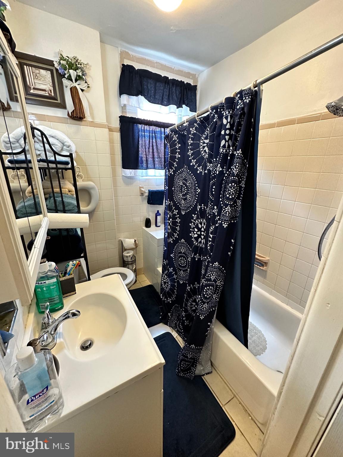 6148 Reedland Street Philadelphia, PA 19142 - Photo 12 of 20 a bathroom with a sink toilet and shower
