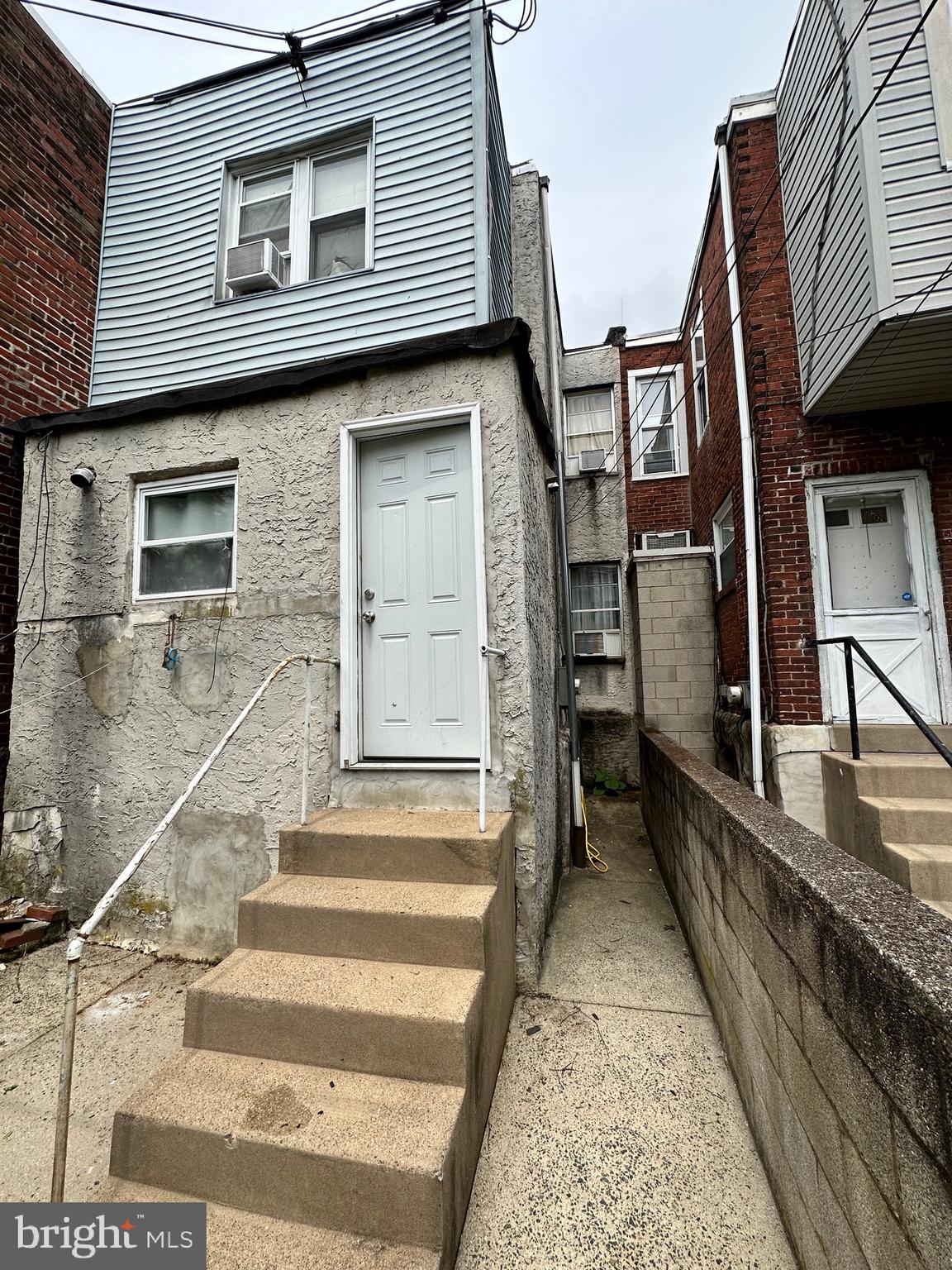 6148 Reedland Street Philadelphia, PA 19142 - Photo 19 of 20 a view of a house with a wooden deck