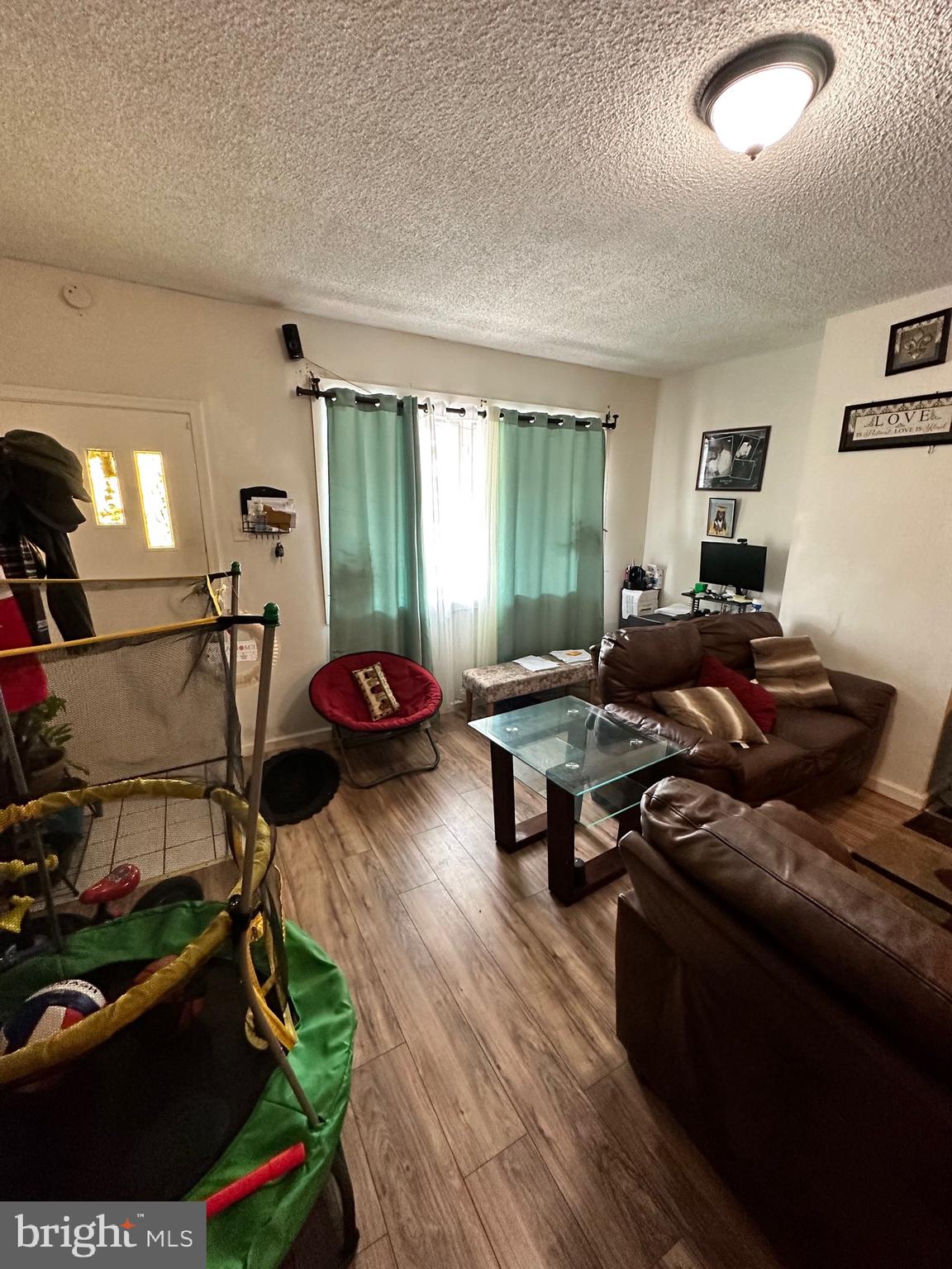 6148 Reedland Street Philadelphia, PA 19142 - Photo 2 of 20 a living room with furniture and a wooden floor