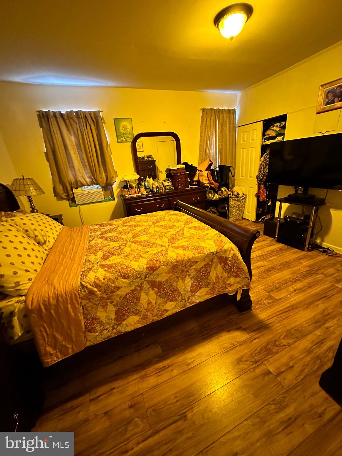 6148 Reedland Street Philadelphia, PA 19142 - Photo 9 of 20 a bedroom with bed and wooden floor