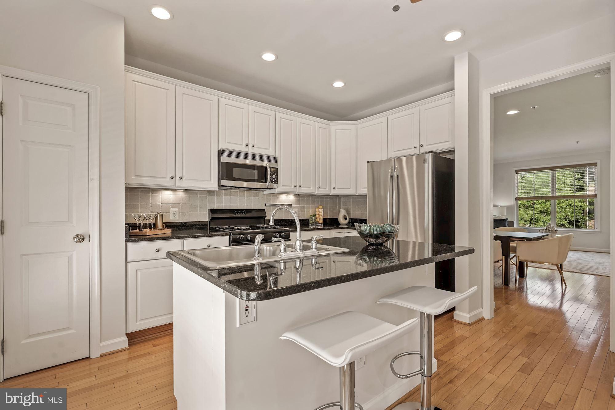 724 Capitol Square Place Southwest Washington, DC 20024 - Photo 15 of 40 Crisp white cabinets w/granite countertops