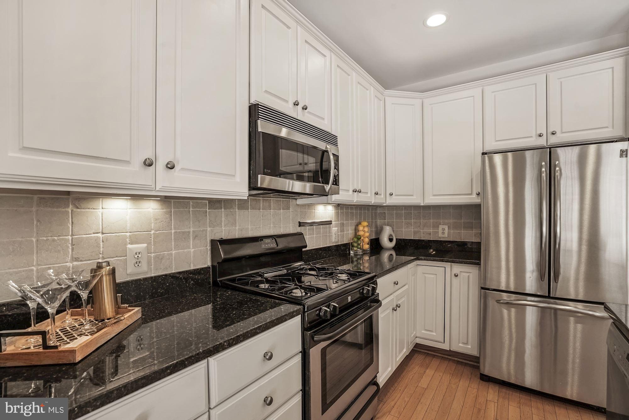 724 Capitol Square Place Southwest Washington, DC 20024 - Photo 16 of 40 Ceramic tile backsplash w/under-cabinet lighting