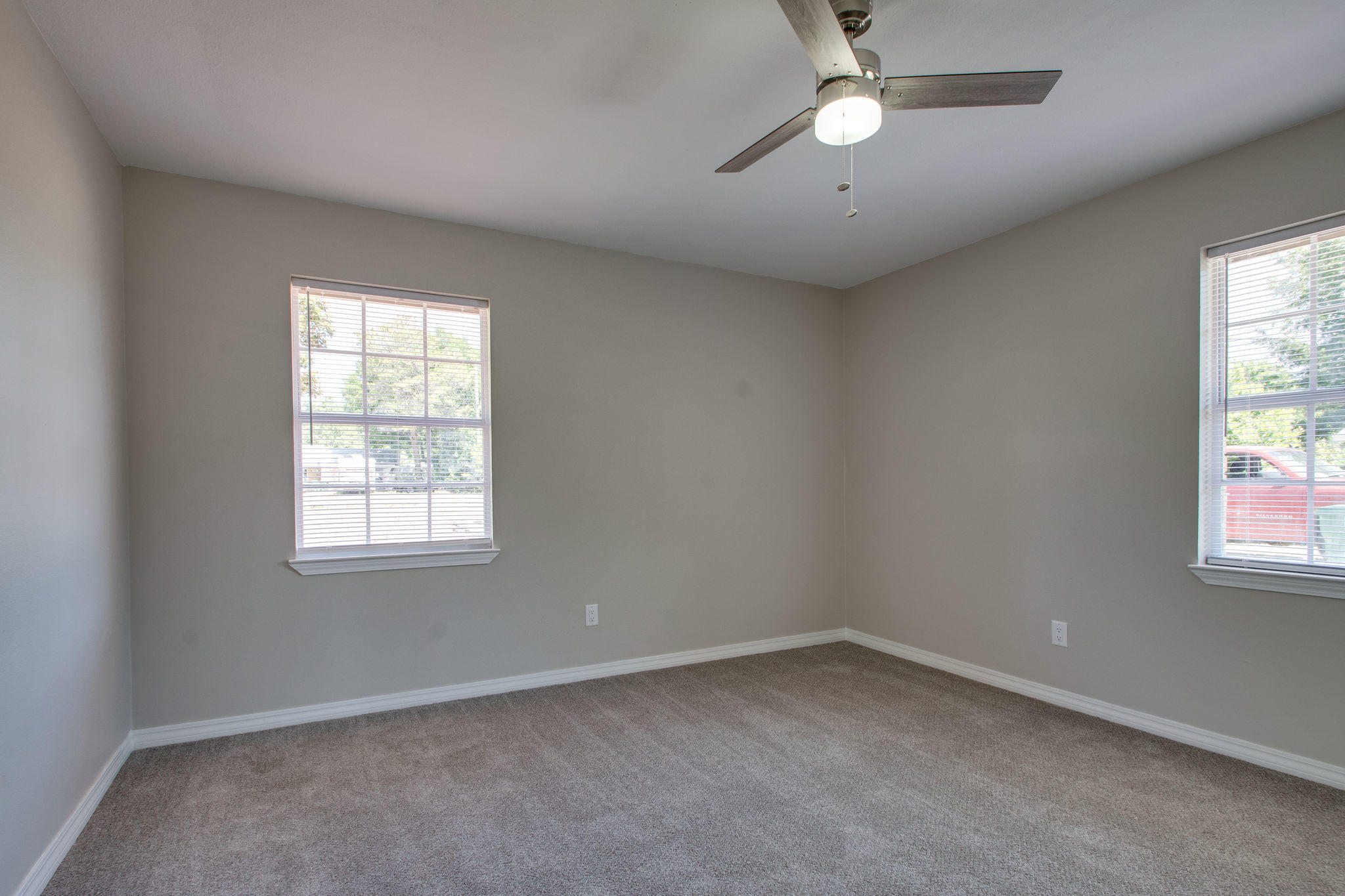 409 Main Street Destin, FL 32541 - Photo 15 of 19 an empty room with a window and a fan