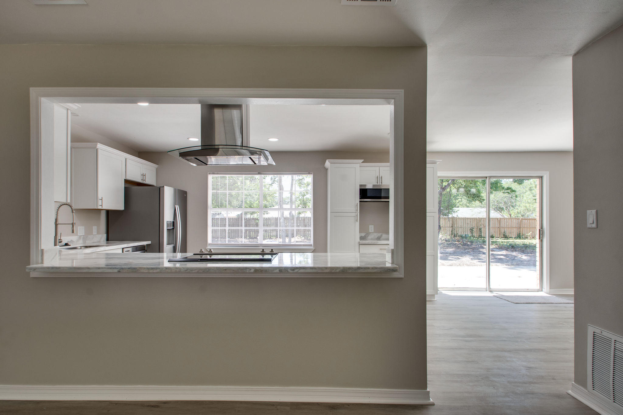 409 Main Street Destin, FL 32541 - Photo 8 of 19 a view of kitchen with window and wooden floor