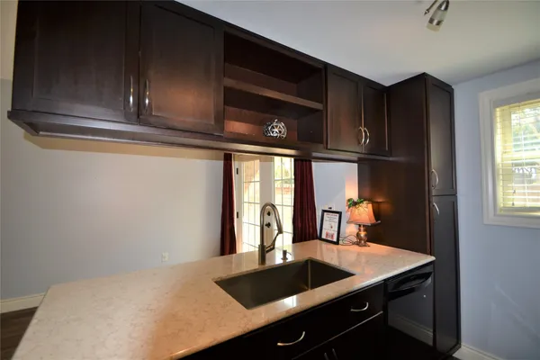 a kitchen with a sink and cabinets