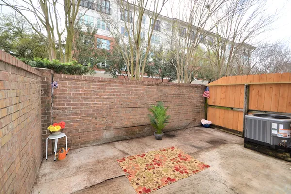 a view of a backyard with sitting area
