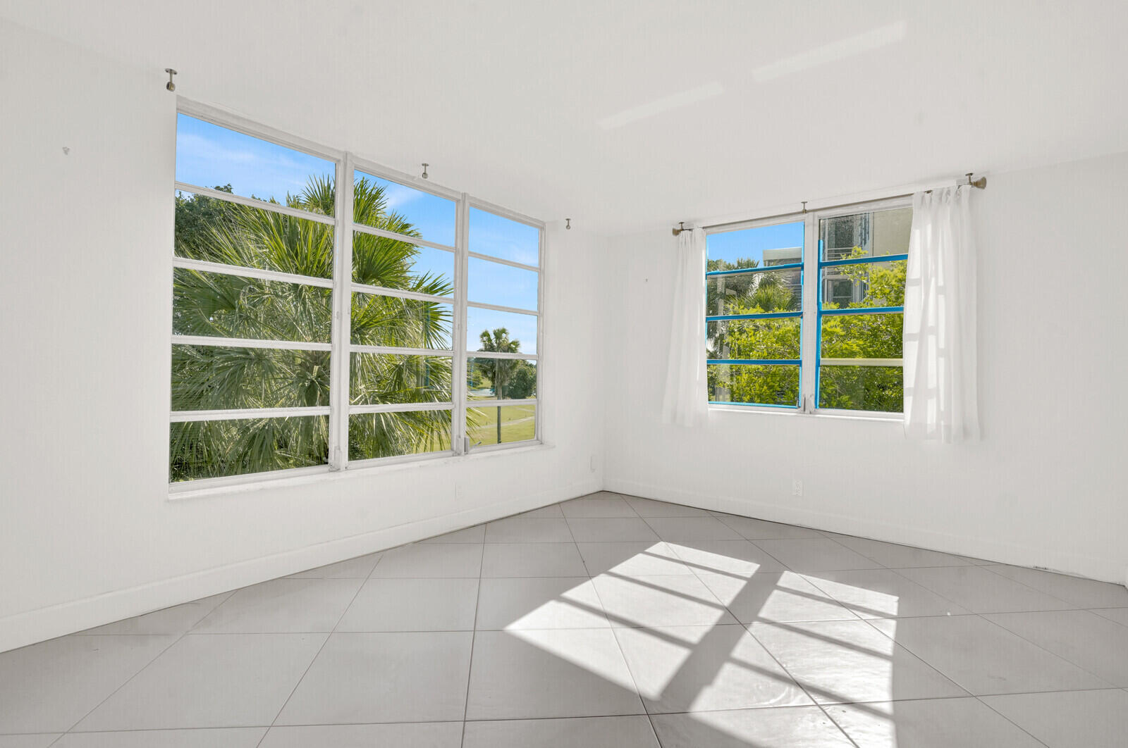 804 Cypress Boulevard, Unit 301 Pompano Beach, FL 33069 - Photo 14 of 34 a view of an empty room with a window