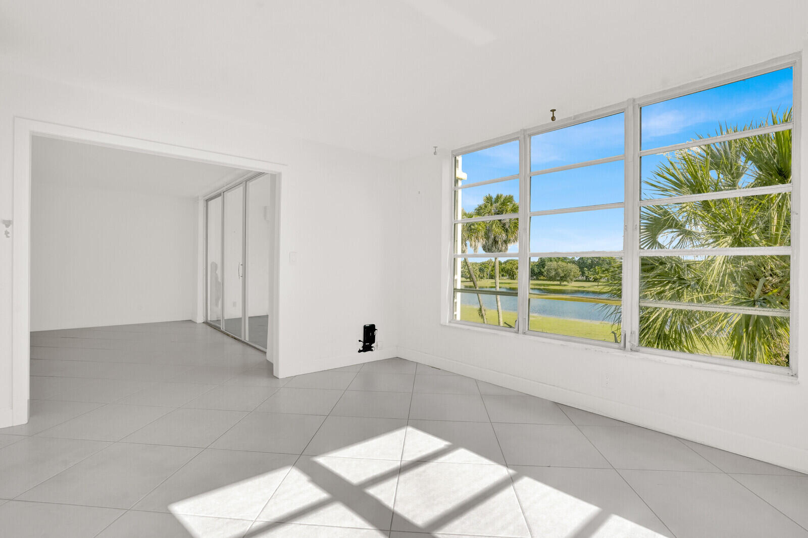 804 Cypress Boulevard, Unit 301 Pompano Beach, FL 33069 - Photo 15 of 34 a view of a room with a large window