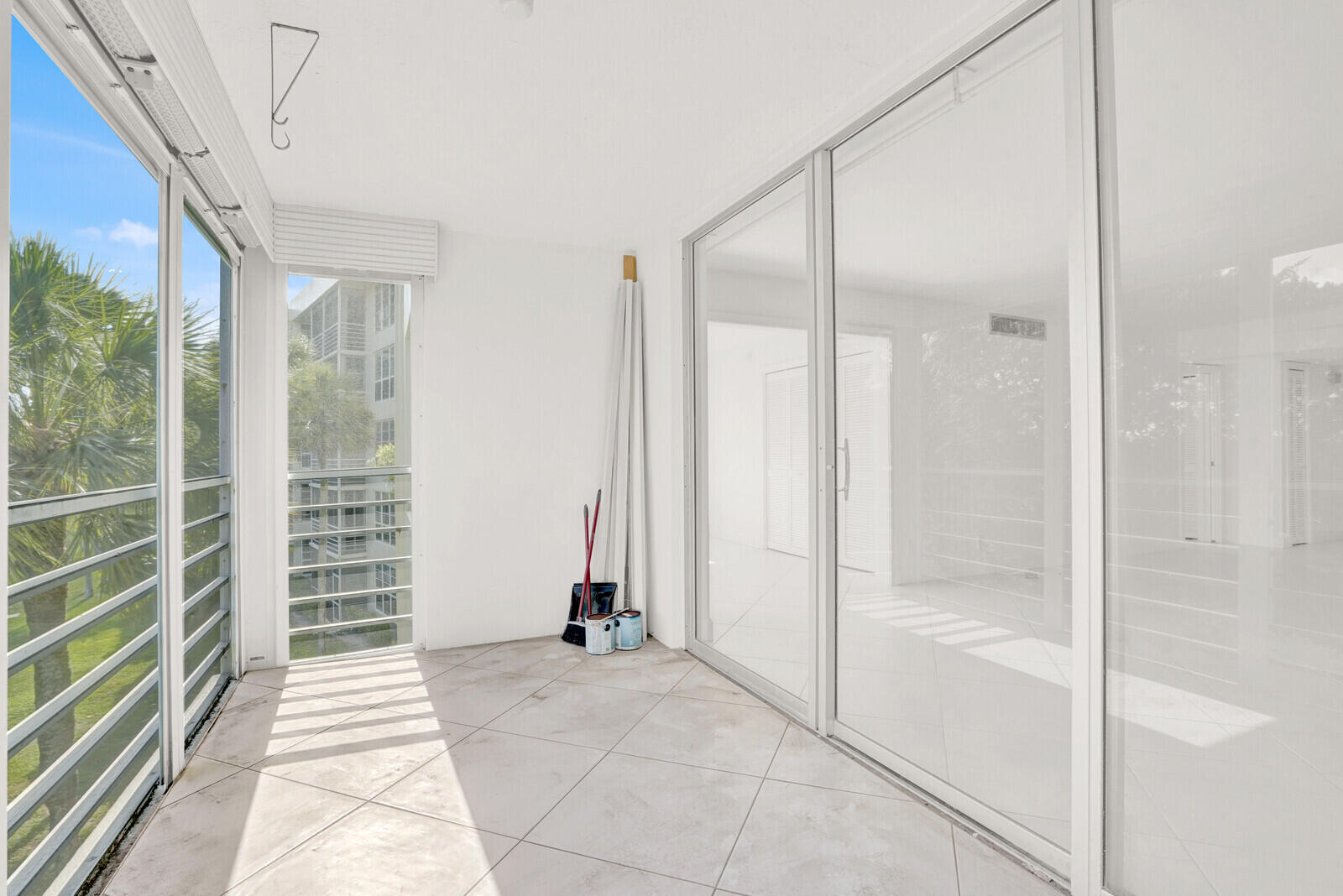 804 Cypress Boulevard, Unit 301 Pompano Beach, FL 33069 - Photo 27 of 34 a view of a bathroom with a glass door shower and a sink