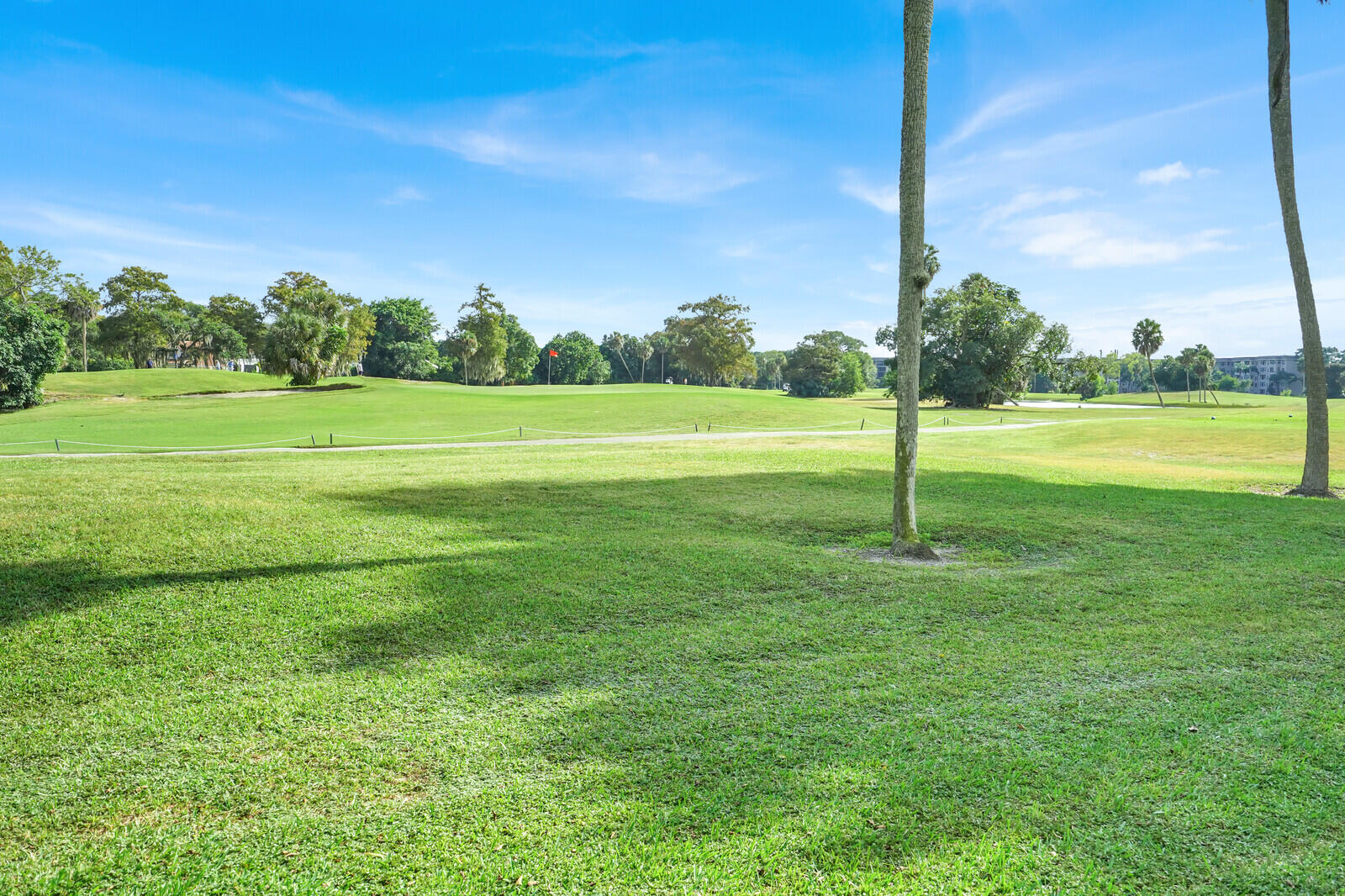 804 Cypress Boulevard, Unit 301 Pompano Beach, FL 33069 - Photo 30 of 34 a backyard of a house with lots of green space