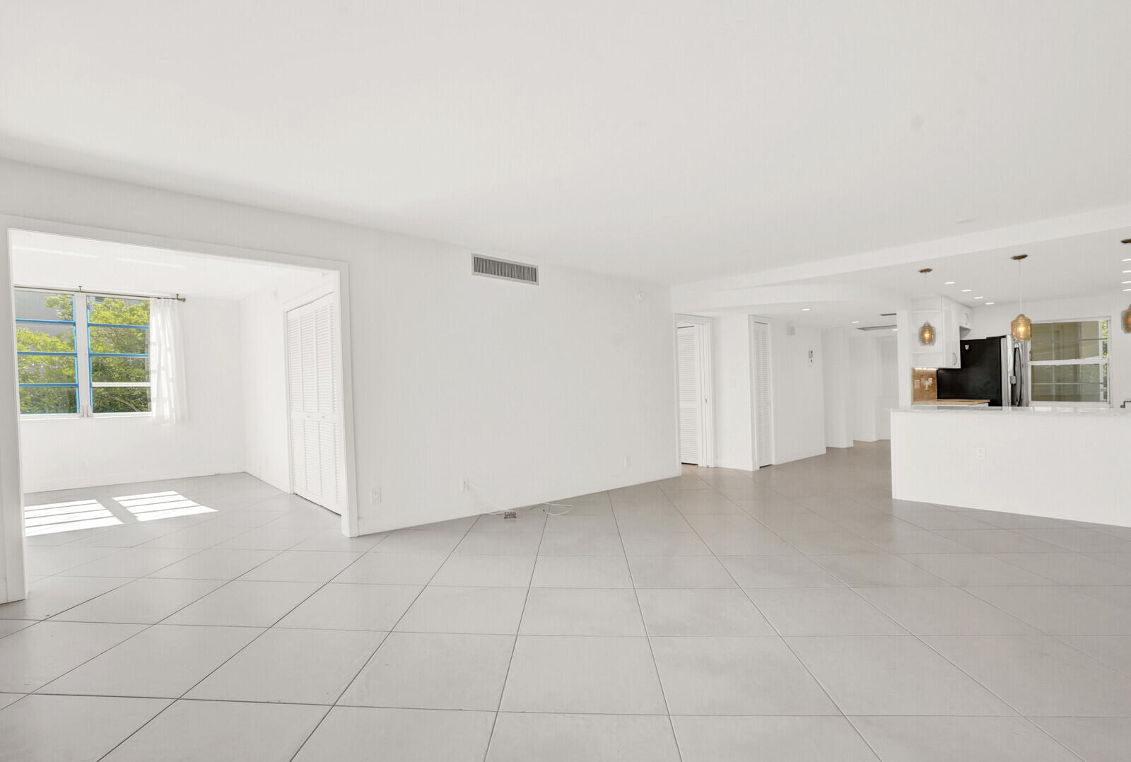 804 Cypress Boulevard, Unit 301 Pompano Beach, FL 33069 - Photo 5 of 34 a view of a livingroom with an empty space