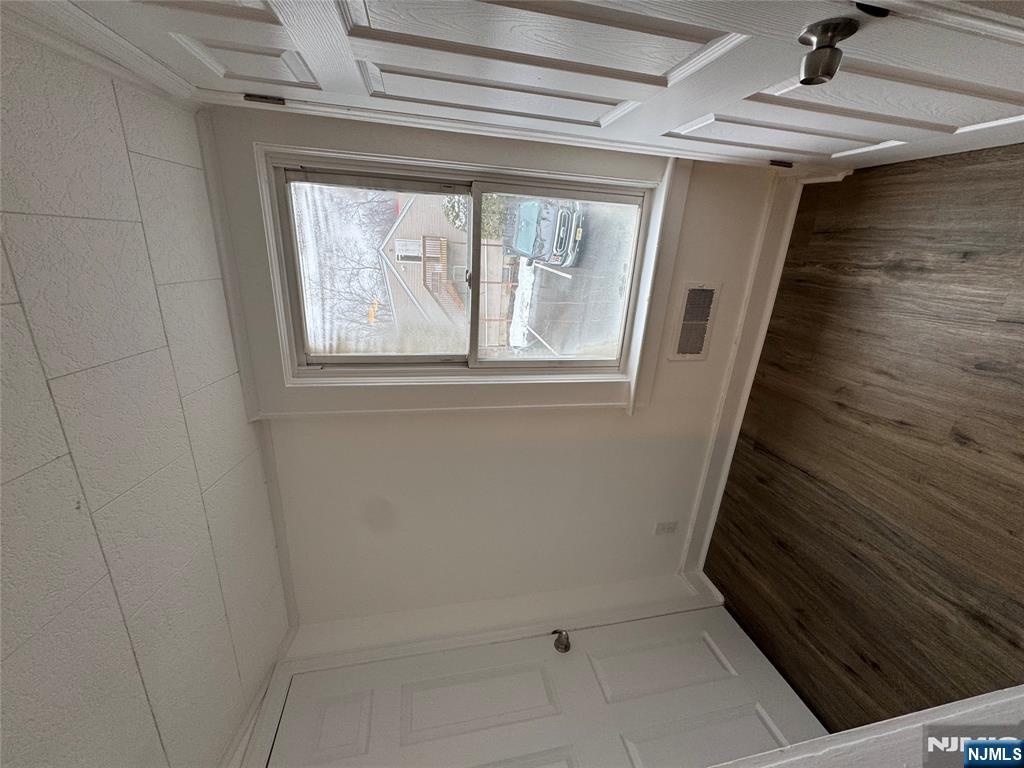57 Old Hook Road, Unit 2 Westwood, NJ 07675 - Photo 6 of 13 a view of a room that has wooden floor and a window