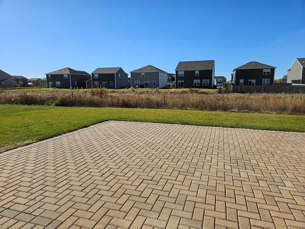 a view of a house with backyard and garden