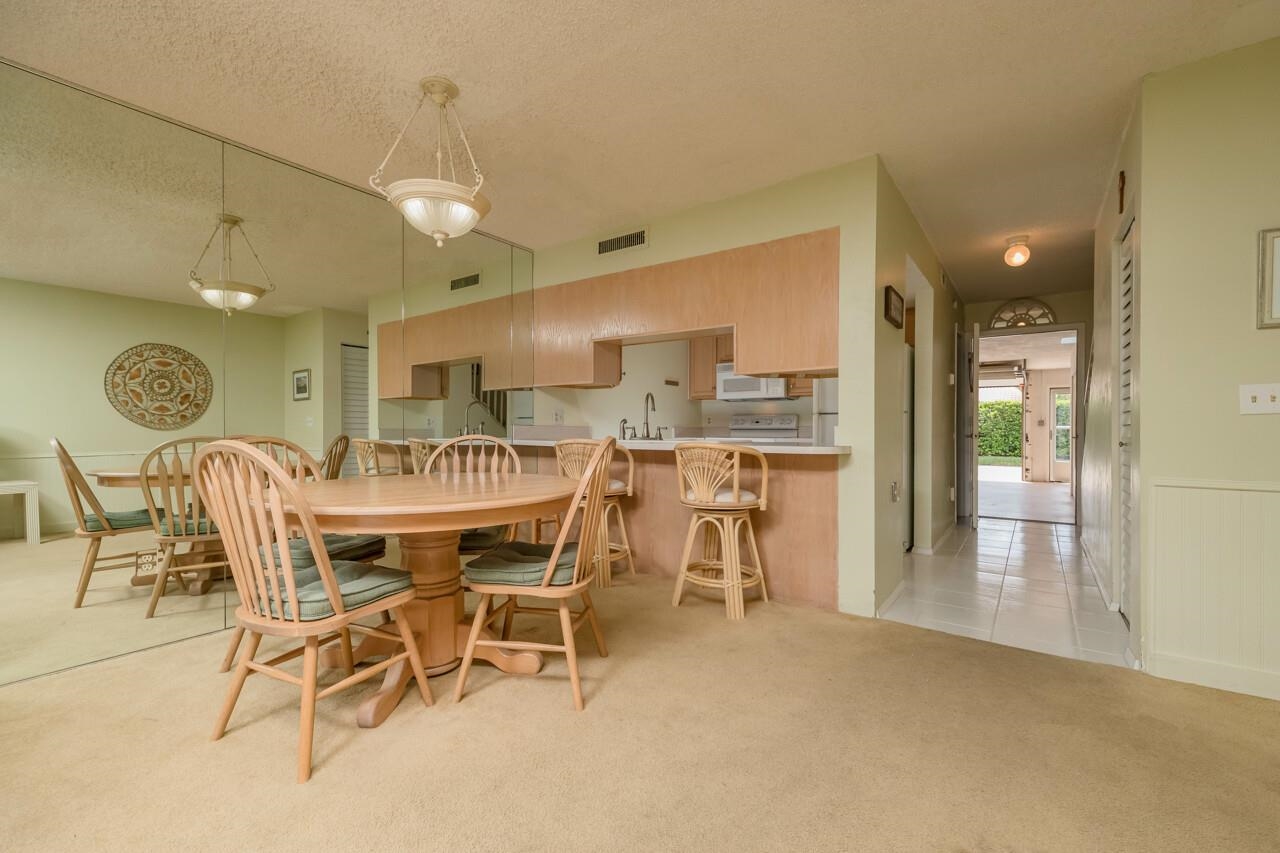 21 Dondanville Road, Unit 2 St. Augustine, FL 32080 - Photo 11 of 40 a dining room with furniture and a large window