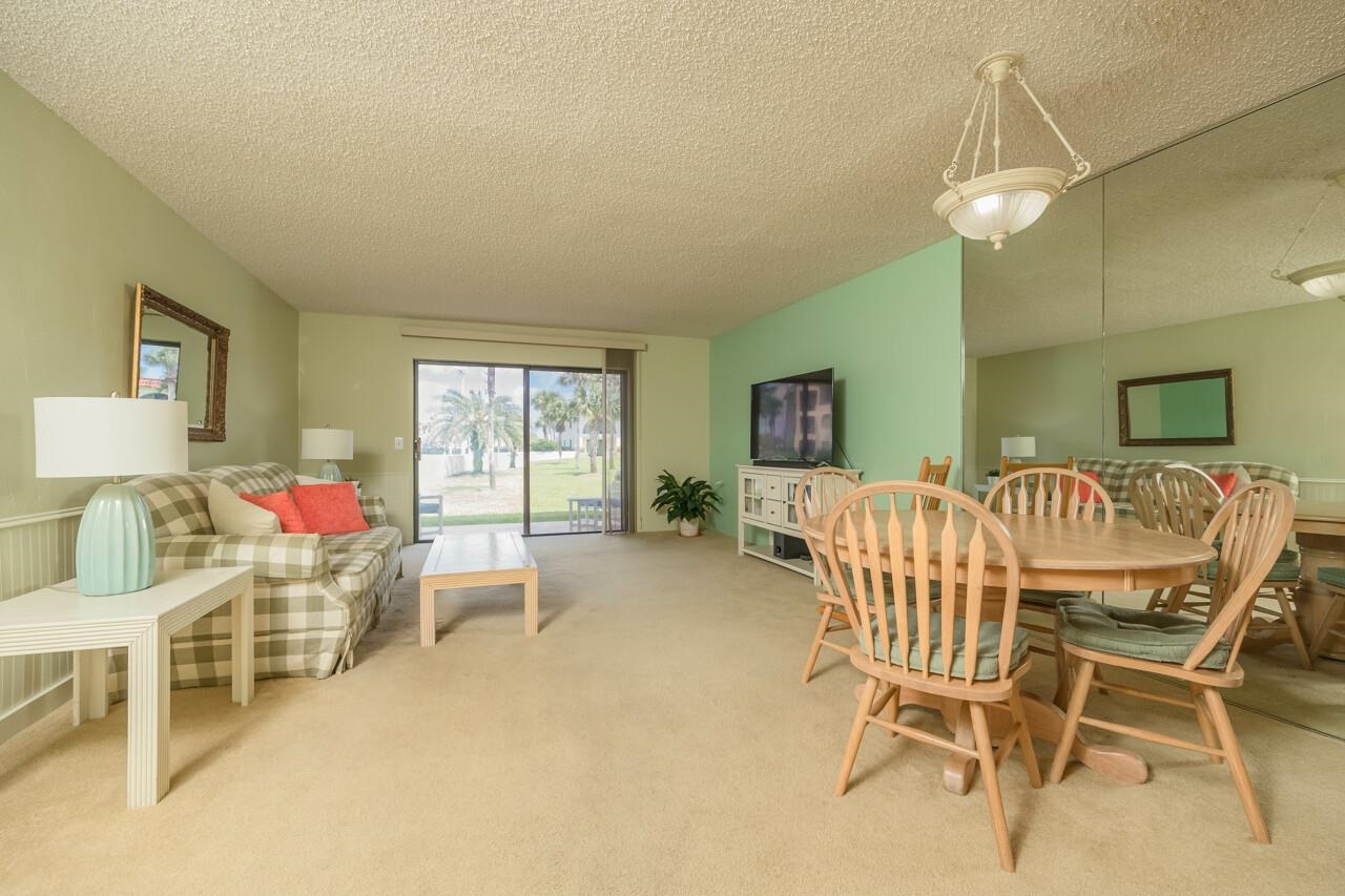 21 Dondanville Road, Unit 2 St. Augustine, FL 32080 - Photo 12 of 40 a dining room with furniture and window